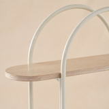 Close-up of the Umbria Natural Oak capsule-ended shelf and overlapping ivory tubular arches