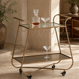 Grazia Gold Bar Trolley in a premium Mediterranean dining interior