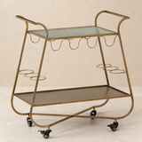Grazia Gold Bar Trolley in a warm beige studio