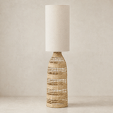Hampton Woven Floor Lamp Natural in a warm beige studio