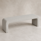 Veneziana continuous waterfall bench in fine stone-ivory woven upholstery with exactly two broad end-panel supports, elevated angle