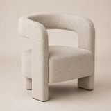 Ventoux natural flecked upholstered armchair with continuous horseshoe back and arms, open back, one thick seat and exactly four block legs, Elara studio view