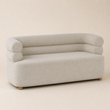 Vernazza compact sofa in fine gray-ivory woven fabric with monolithic base, continuous seat, exactly two stacked rounded bolster rails curving into both arms and low wooden ball feet, Elara studio