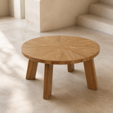 Elevated angle of the Verona circular sunburst wood coffee table with exactly four broad splayed slab legs