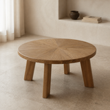 Alternate lifestyle angle of the Verona round natural wood coffee table with radial top and four slab legs
