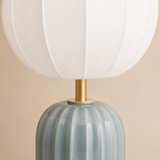 Close detail of the Wilton blue-grey glazed ceramic flutes, rounded shoulder, brass neck and fine ribbed translucent white shade